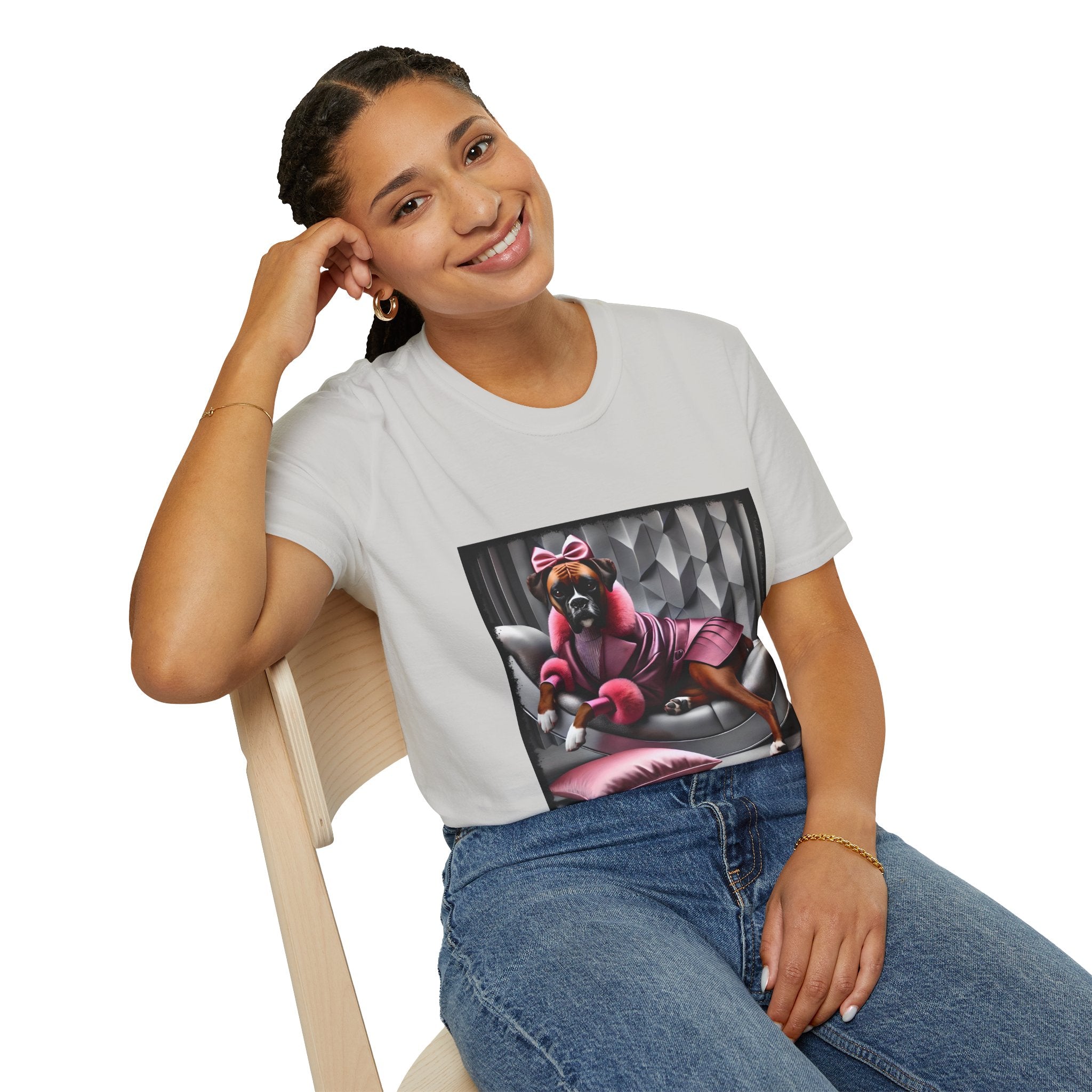 Female model in ice gray dog t-shirt featuring boxer in pink bow and pleated pink coat lounging on silver settee.