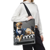 A person carries a large tote bag over their shoulder. The tote bag features a printed graphic of a yellow Labrador retriever dressed in a blue suit and bow tie, lounging on a black tufted leather sofa.