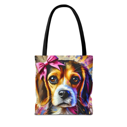 A tote bag with black handles and a colorful, painterly-style print of a beagle's face wearing a pink bow, shown on a plain white background.