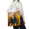 Cream-colored Beagle Tote Bag with white  handles, printed with a beagle in a navy hoodie sitting on a golden chair, surrounded by bright lemons.