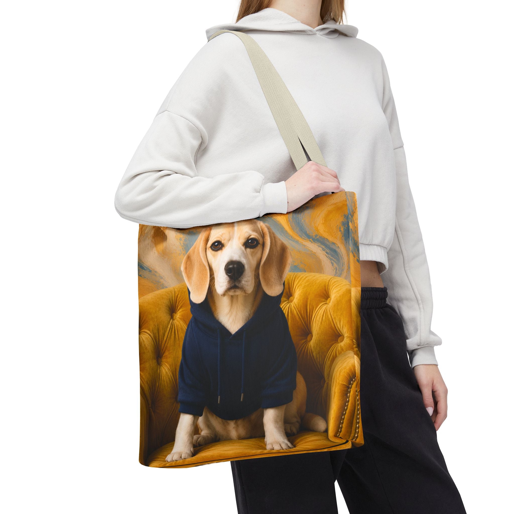 Cream-colored Beagle Tote Bag with white  handles, printed with a beagle in a navy hoodie sitting on a golden chair, surrounded by bright lemons.