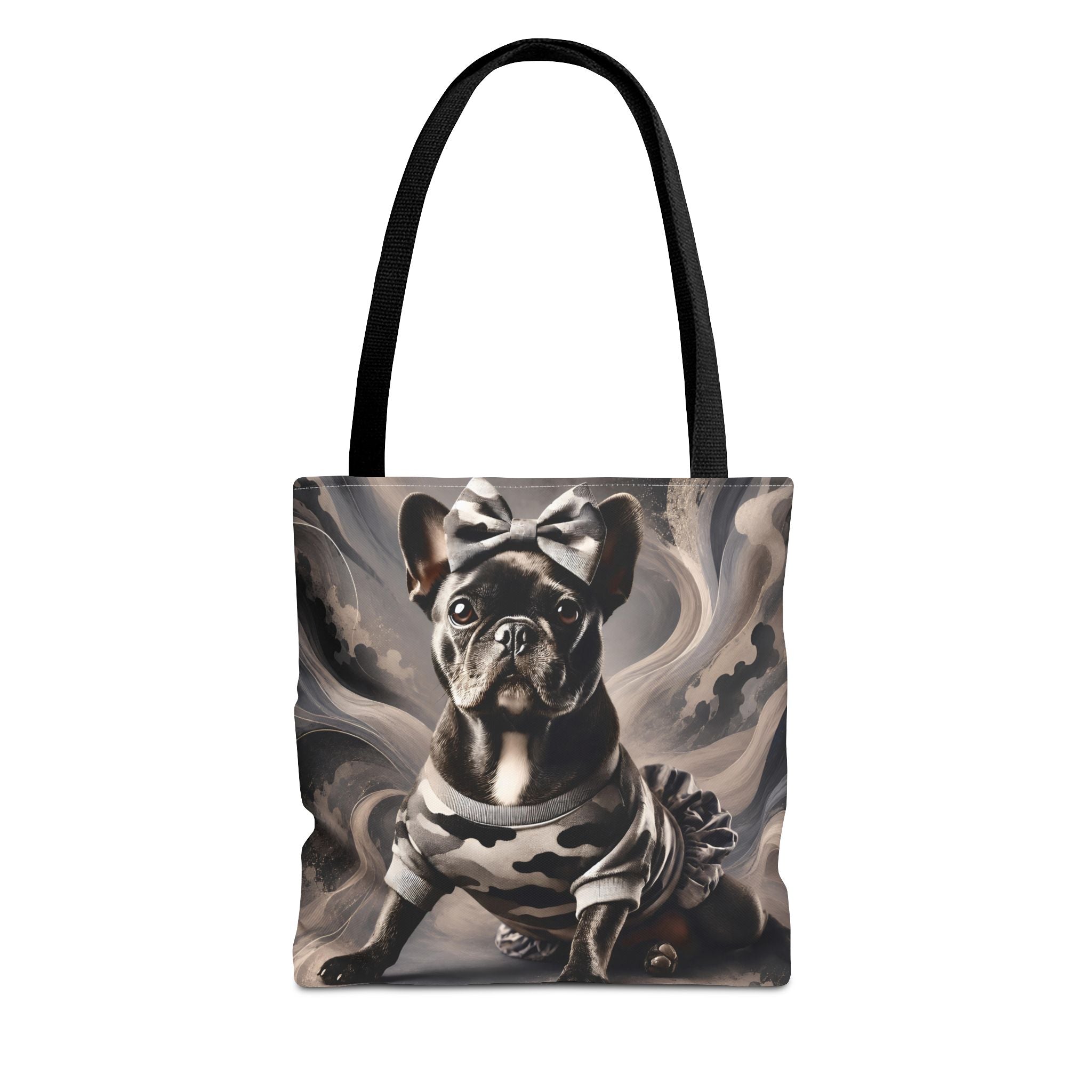 A tote bag with black handles featuring a printed graphic of a French Bulldog wearing a bow and a camouflage-patterned dress, set against a swirling gray and white background.