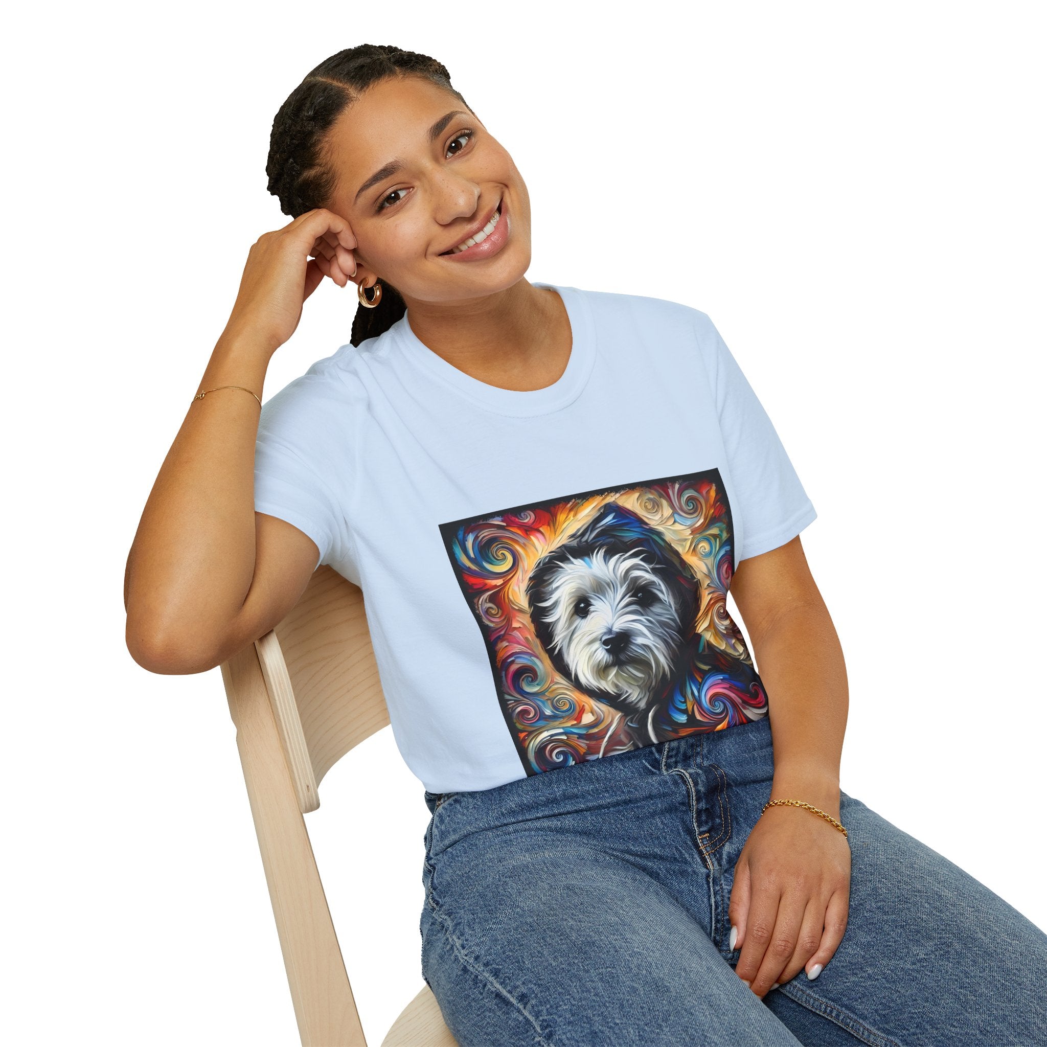 Female model in light blue dog t-shirt featuring Westie in black hoodie with swirling red blue orange and gold background.