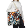 A person wearing a white hoodie and black sweatpants carries a canvas tote bag featuring a colorful geometric beagle dog portrait. The bag has a beige shoulder strap and is shown against a plain white background.