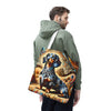 A man wearing an olive green hoodie is shown from the back and side, carrying a canvas tote bag over his shoulder. The bag features a detailed, colorful graphic print of a dachshund surrounded by swirling abstract patterns in blue, orange, brown, and gold.