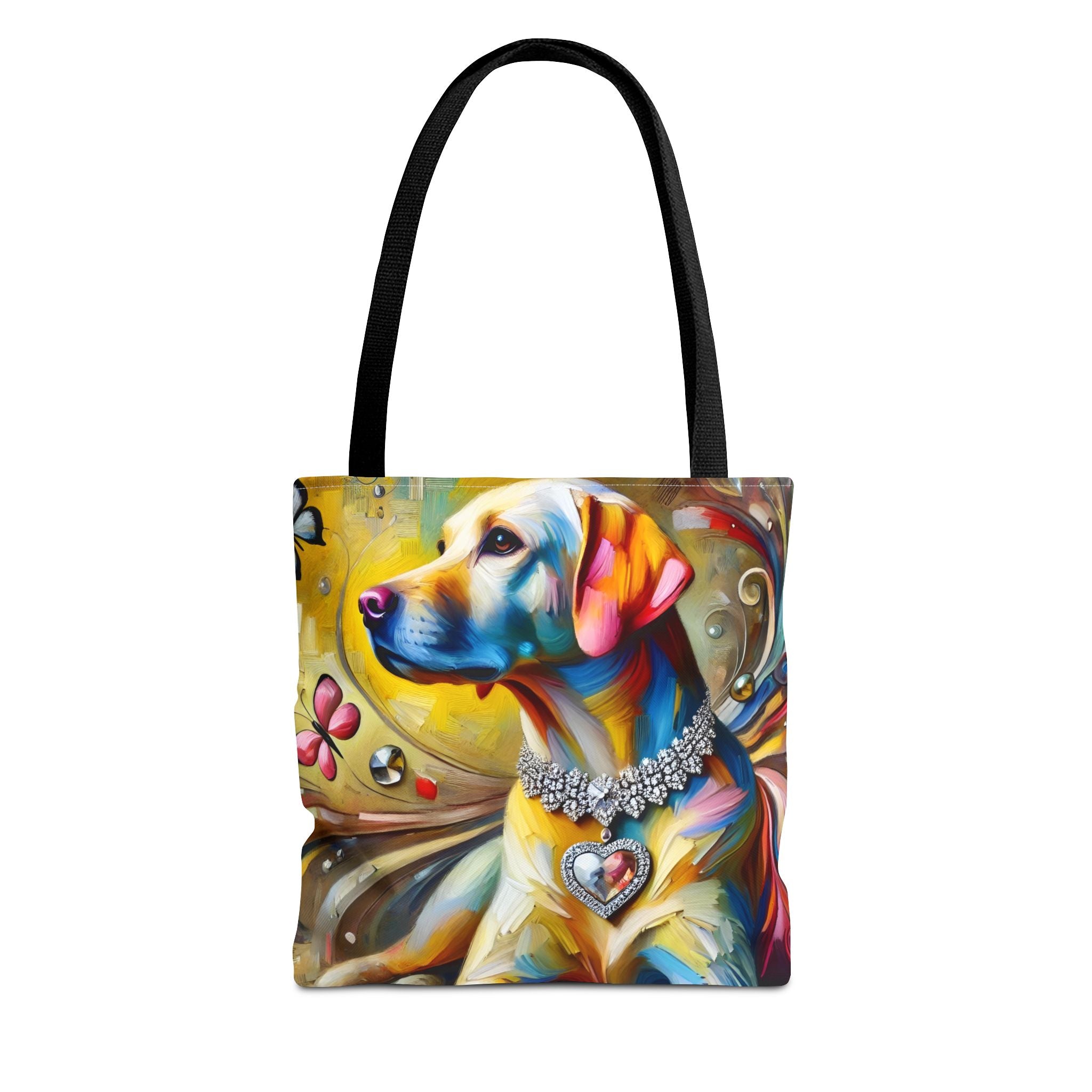 A tote bag with black shoulder straps, featuring a colorful artistic print of a yellow Labrador retriever wearing a jeweled collar, shown against a plain white background.