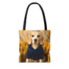 A tote bag with black handles, featuring a printed graphic of a beagle dog wearing a navy blue hoodie, seated on a tufted yellow armchair against a swirling gold and blue background.