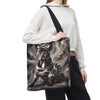 A person wearing a white cropped hoodie and black sweatpants carries a large tote bag with a printed illustration of a black French bulldog on a smoky gray background. The bag has a black shoulder strap and is shown against a plain white studio background.
