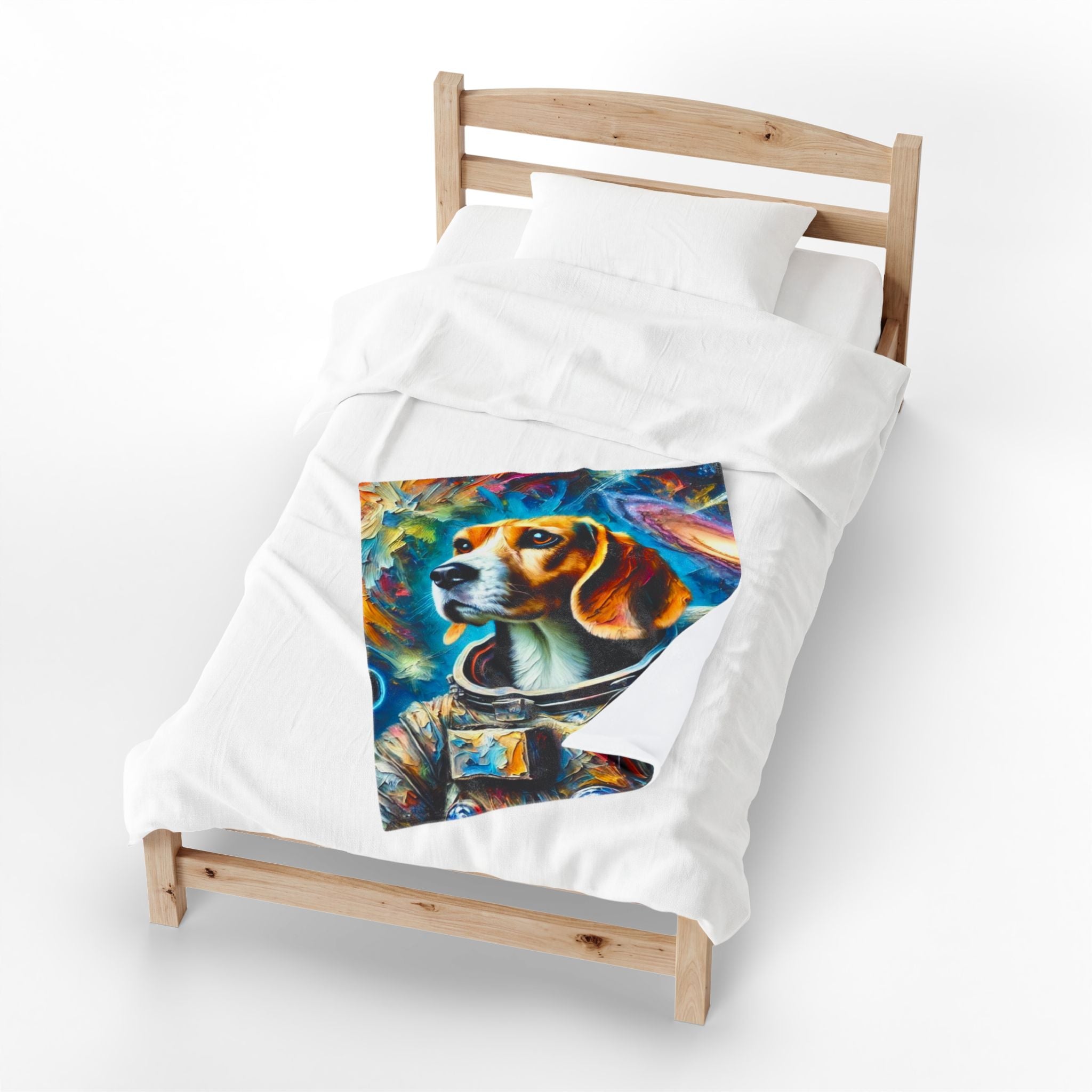 A white duvet cover on a wooden single bed, featuring a colorful printed graphic of a beagle dog wearing a space helmet against a cosmic background.