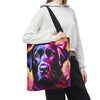 A person wearing a white cropped hoodie and black sweatpants carries a canvas tote bag with a colorful graphic print of a black Labrador wearing a pink bow, against a plain white background.