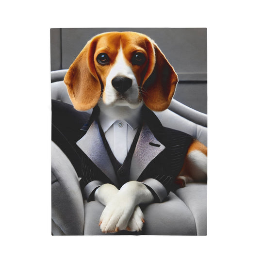 A blanket showing a beagle dressed in a black tuxedo jacket and white shirt, seated on a gray chair against a dark gray background.
