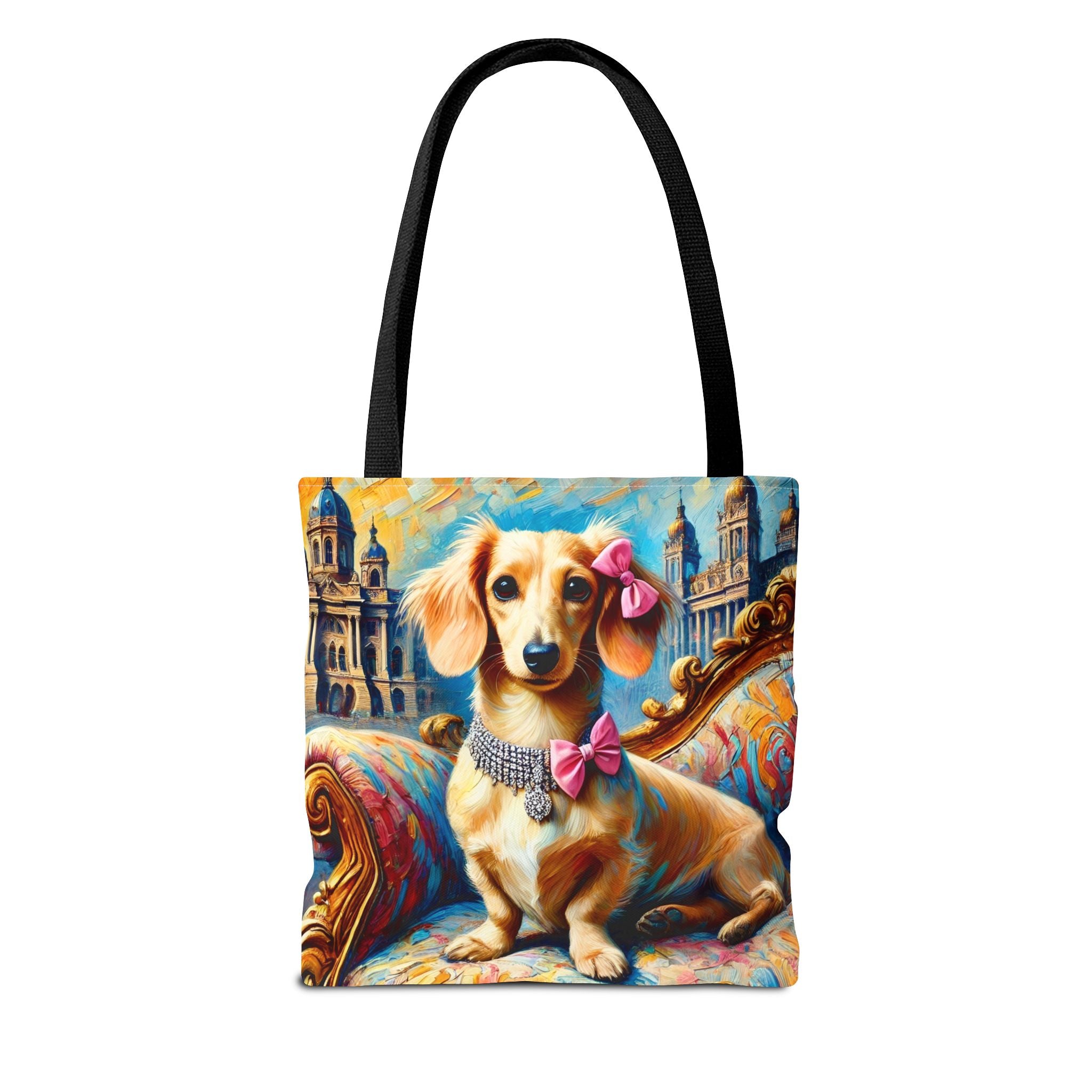 A tote bag with black handles featuring a colorful printed illustration of a dachshund wearing pink bows and a jeweled collar, seated on an ornate sofa with a cityscape background.