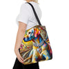 A woman carries a colorful tote bag featuring a stylized, multicolored painting of a yellow Labrador retriever wearing a jeweled collar, against a plain white background.