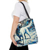 A woman wearing a carries a canvas tote bag with a black shoulder strap. The bag features a detailed, textured painting of a white Labrador retriever with blue and white brushstrokes.
