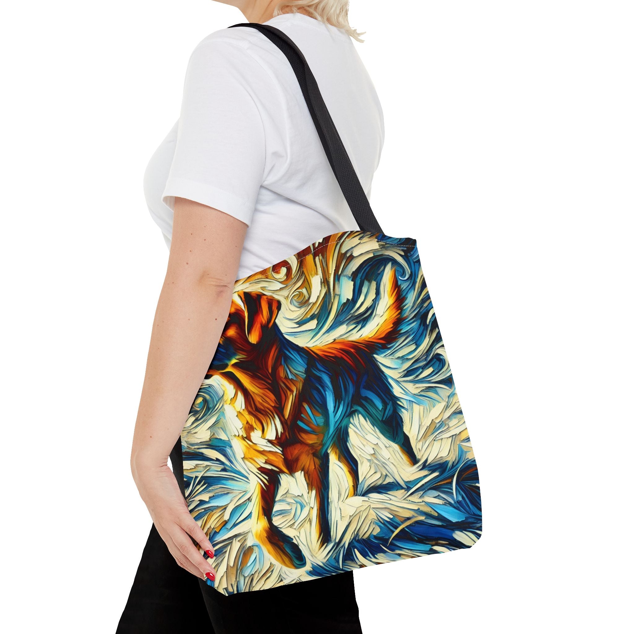 A woman wearing carries a canvas tote bag with a black shoulder strap. The bag features a vibrant, textured painting of a yellow Labrador retriever in shades of blue, orange, yellow, and white.