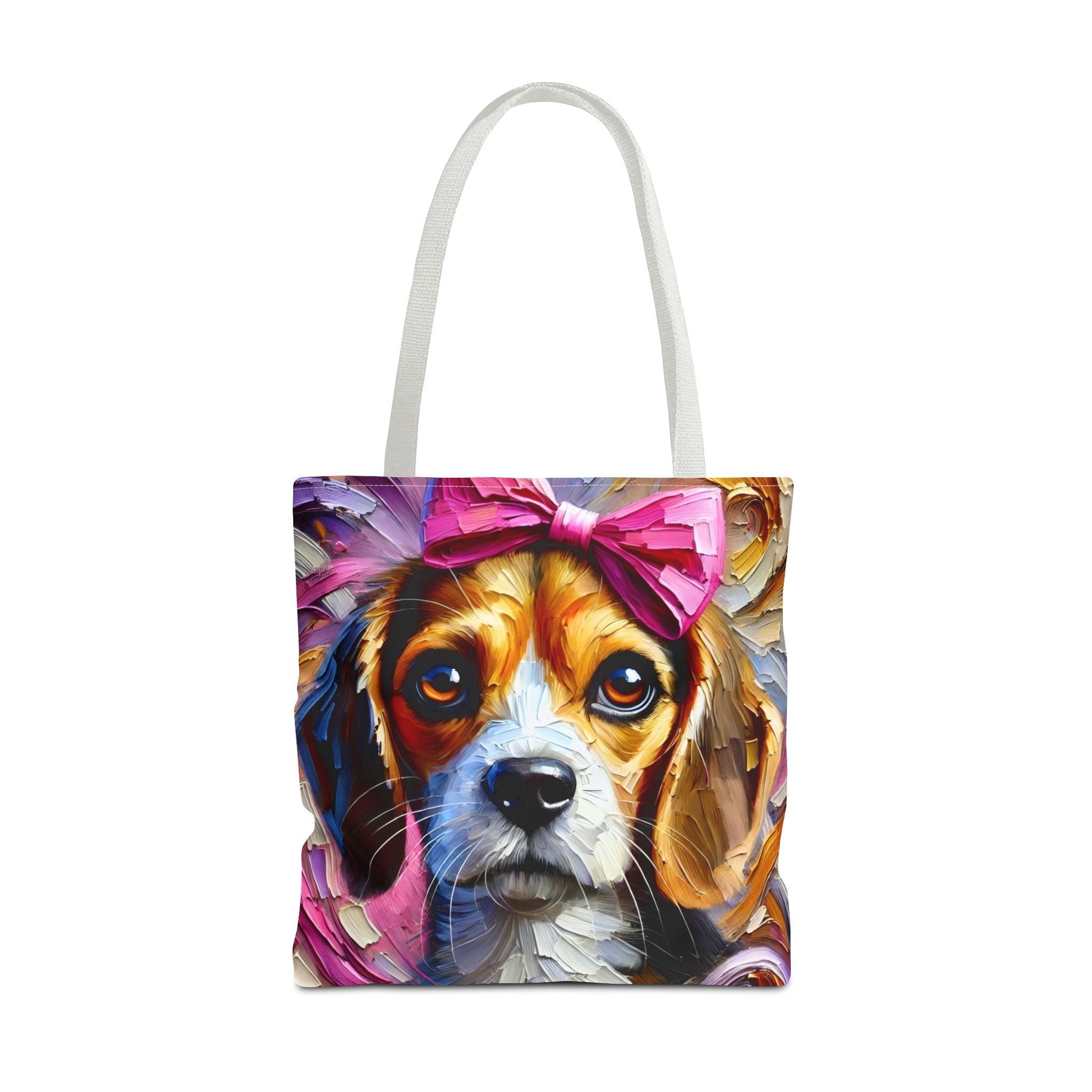 A tote bag with white shoulder straps, featuring a colorful, painterly print of a beagle dog wearing a pink bow, shown against a plain white background.