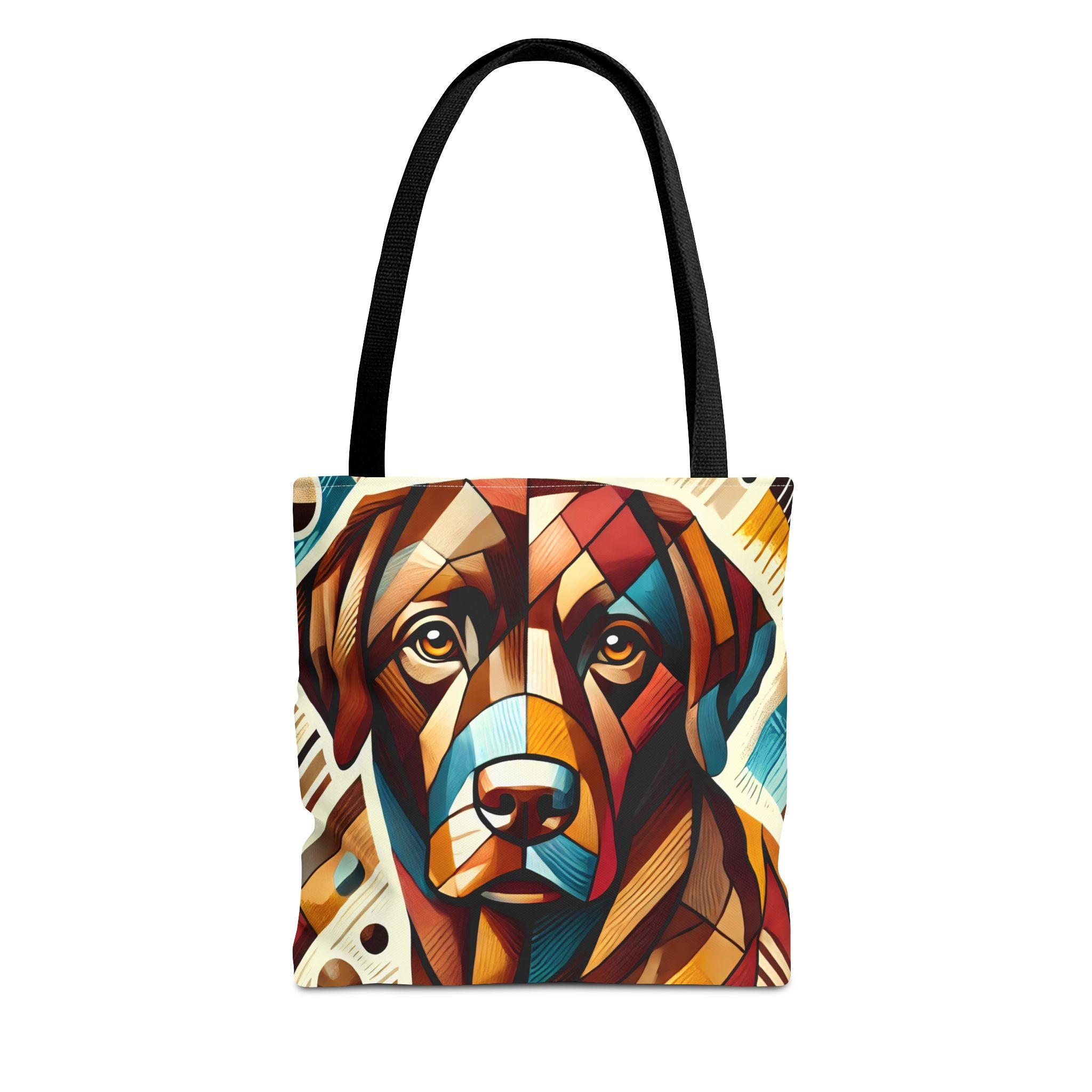 A tote bag with black shoulder straps, featuring a colorful geometric art print of a chocolate Labrador retriever face on the front, set against a plain white background.