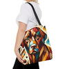 A woman carries a canvas tote bag featuring a colorful geometric chocolate Labrador retriever portrait. The bag has a black shoulder strap.