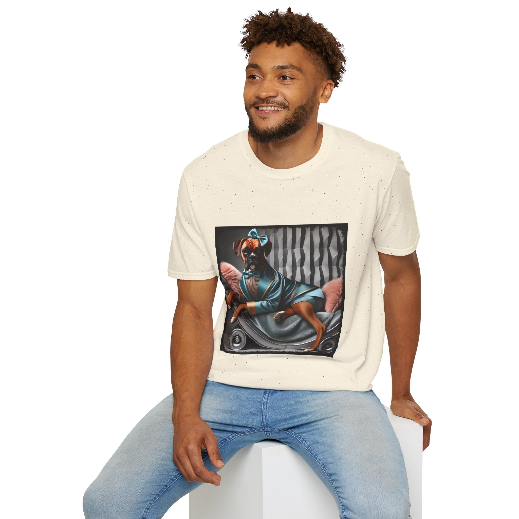 Male model in natural dog t-shirt with a boxer in teal dress and bow on modern chair with striped wall and pink pillows.