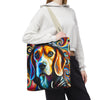 A person wearing a white cropped hoodie and black sweatpants carries a canvas tote bag over their shoulder. The bag features a vibrant, colorful abstract painting of a beagle's face with swirling paint patterns.