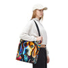 A woman wearing a white sweatshirt, black pants, and a white cap carries a canvas tote bag featuring a colorful, swirling abstract beagle dog print against a plain white background.