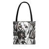 A tote bag featuring a black and white graphic illustration of a Labrador retriever wearing a suit and tie, with the dog's eyes highlighted in orange, and black shoulder straps, shown against a plain white background.