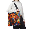 A person wearing a white cropped hoodie and black sweatpants carries a canvas tote bag with a colorful painted red fox Labrador Retriever portrait on the front. The bag has a black shoulder strap and is shown against a plain white background.