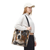 A tote bag with black handles featuring a printed portrait of an Australian Shepherd dog with one blue eye and one brown eye, set against a plain white background.