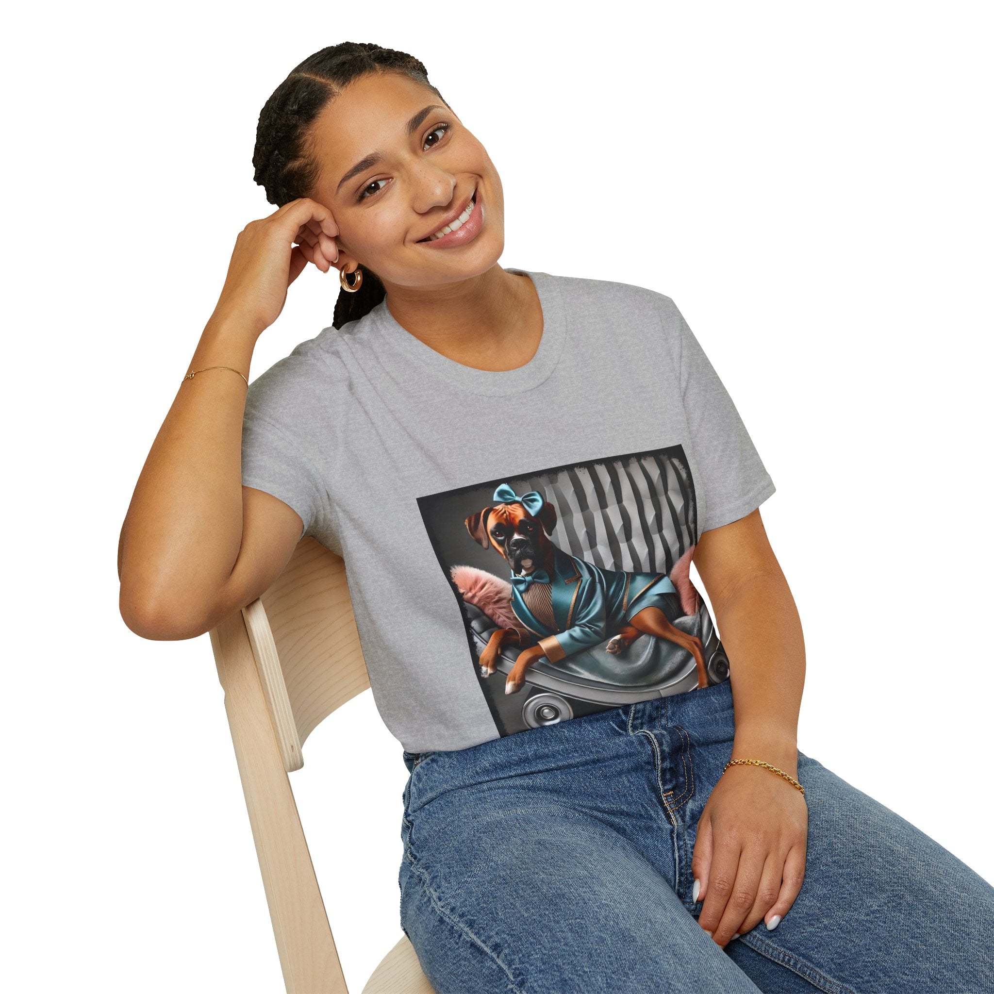 Female model in sport gray dog t-shirt with a boxer in teal dress and bow on modern chair with striped wall and pink pillows.