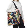 A person wearing a white cropped hoodie and black sweatpants carries a large tote bag with a colorful artistic print of a black Labrador retriever wearing a silver collar and heart pendant, against a plain white background.